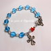 Bracciale rosario con cristalli azzurri e rosso, idea regalo.