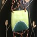 Braccialetto con placca verde e perla vetro trasparente