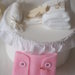 BOMBONIERA da BAMBINA (nascita,battesimo).Pannolino rosa in feltro con bottoncini e spilla.Fatta a mano