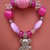 Bracciale elastico pietre rosa e orsetto in argento tibetano