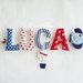 Luca: una ghirlanda di lettere in stoffa imbottite per decorare la cameretta con il suo nome