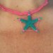 Collana girocollo in stile mare rosa fucsia e verde ottanio lavorata all'uncinetto con stella marina 