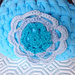 Borsellino portamonete azzurro in fettuccia con fiorellino, fatto a mano all'uncinetto