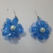 Orecchini plastica fiore blu