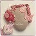 Fiocco nascita casetta in cotone ecrù con uccellino e 4 cuori sui toni rosa/rosa lampone