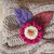 SPILLA in lana e feltro.Due fiori sovrapposti lavorati a telaio,foglie in feltro ricamate.Bottone a cuore in legno dipinto.Fuchsia,ciclamino e lilla.