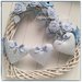 Cuore/fiocco nascita in vimini bianco con roselline e cuori imbottiti azzurri