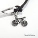 Bracciale simbolo infinito e ciondolo bicicletta 