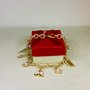 Bracciale in alluminio color oro con charm