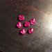 Set di 10 perle in plastica trasparente rosa fucsia