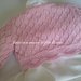 Maglia / coprispalle / giacchino  in cotone rosa con fiori bianchi 