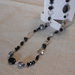 Collana lunga con cristalli e pietre dure nere di varie forme, idea regalo.