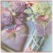 Cuore/fiocco nascita in vimini con roselline,farfalle e due cuori con pizzo sul rosa e bianco