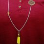 collana lunga in acciaio con nappina gialla in alcantara perle gialle e filigrana color bronzo