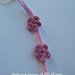 Catenella portaciuccio rosa con fiorellini realizzata a mano a uncinetto