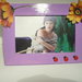 portafoto viola con coccinelle e fiori sospesi