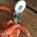 Porta-ciuccio arancio in cotone bio lavorato a tricotin
