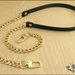 Tracolla per borsa lunga cm.115 - similpelle nera impunturata, catena e moschettoni oro 