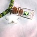 bracciale elastico con perle verdi e ciondolo ampolla/bottiglietta in vetro