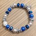 Braccialetto elastico con perle blu e argento e con brillantini