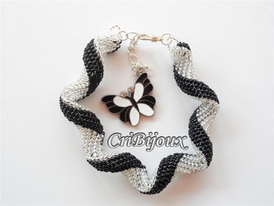 BRACCIALE A SPIRALE CRYSTAL NERO CON PERLINE BRACCIALE A SPIRALE CRYSTAL NERO CON PERLINE