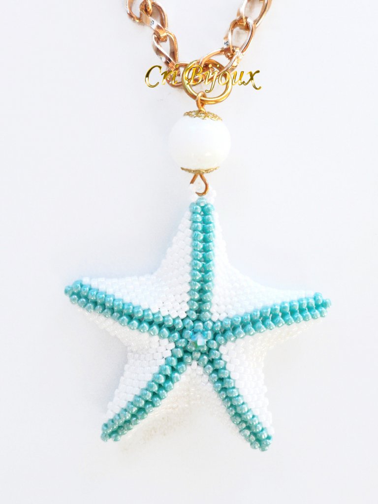 Collana in oro rosa con ciondolo a forma di stella marina impreziosita