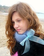 Blue knitted scarf with organza bow