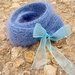 Blue knitted scarf with organza bow