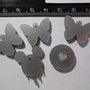 (125) Lotto 5 ciondolini misti in plexiglass argento