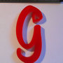 (153) Ciondolo lettera G in plexiglass rosso
